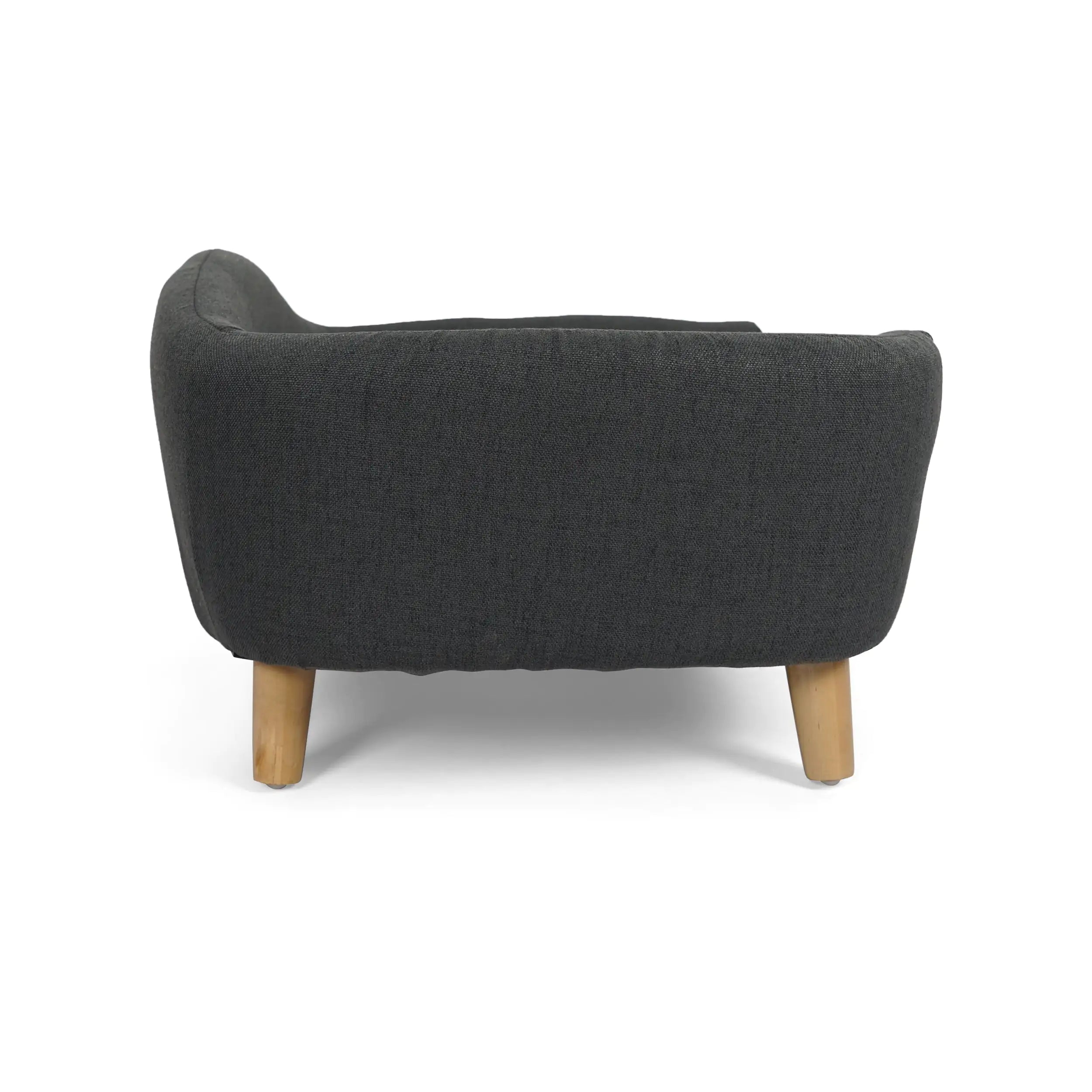 Side view of Marbelle mid-century sofa dog bed with sleek birch wood legs and soft fabric.